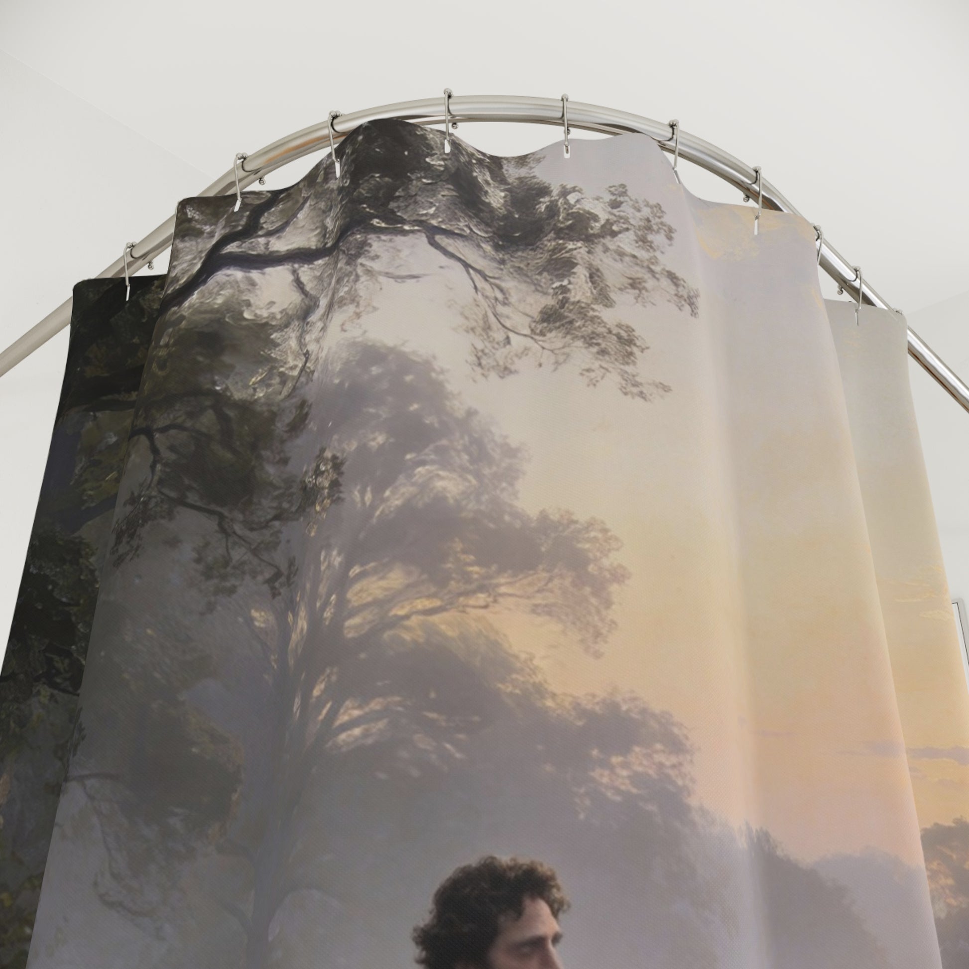 Shower curtain with nature design featuring trees and a person.