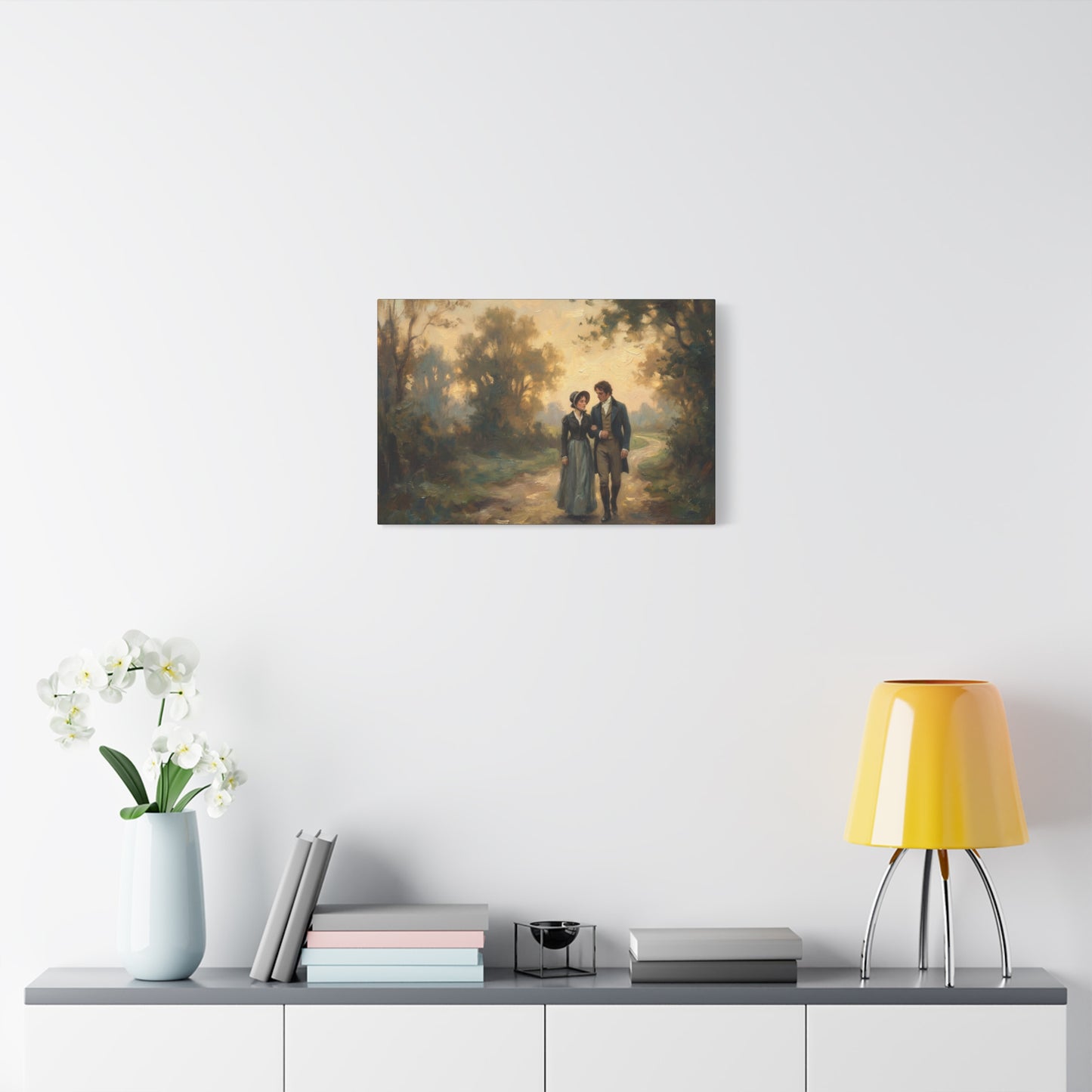 Canvas print of a couple in a forest scene hanging on a wall above a shelf with decor items.