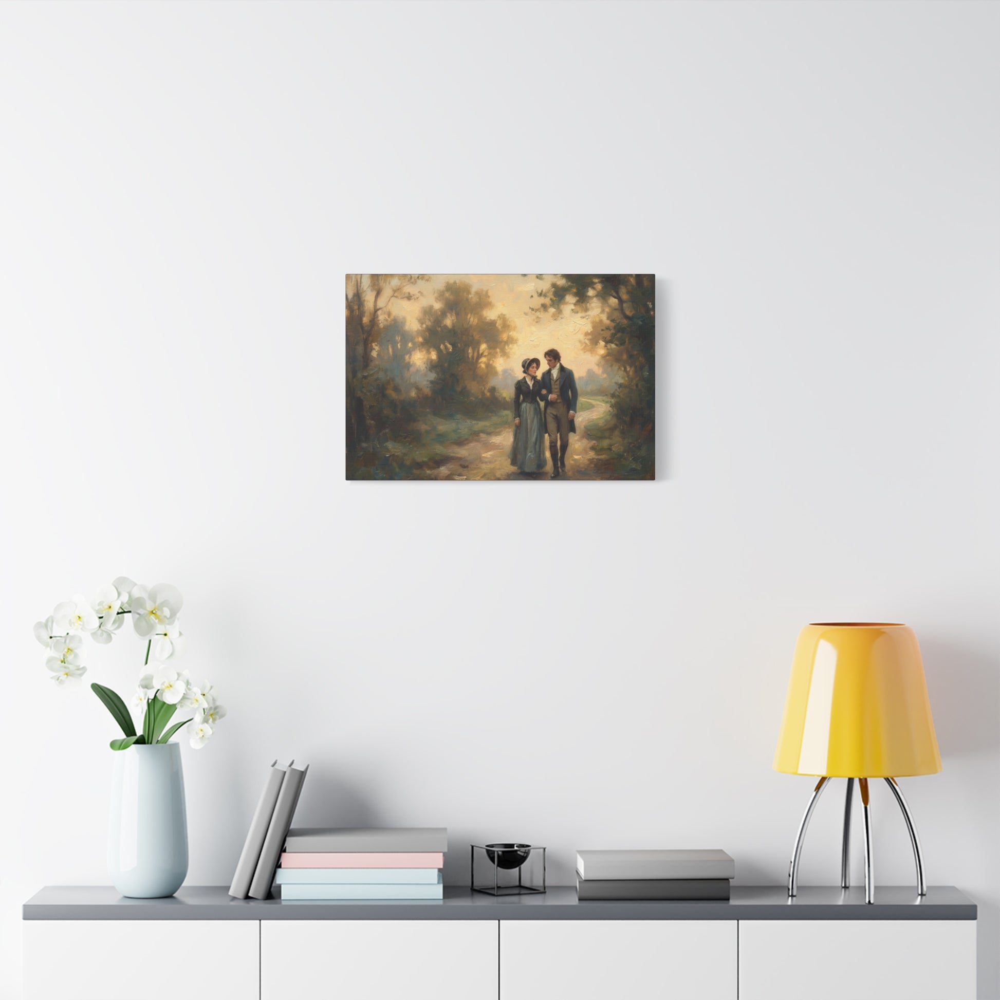 Canvas print of a couple in a forest scene hanging on a wall above a shelf with decor items.