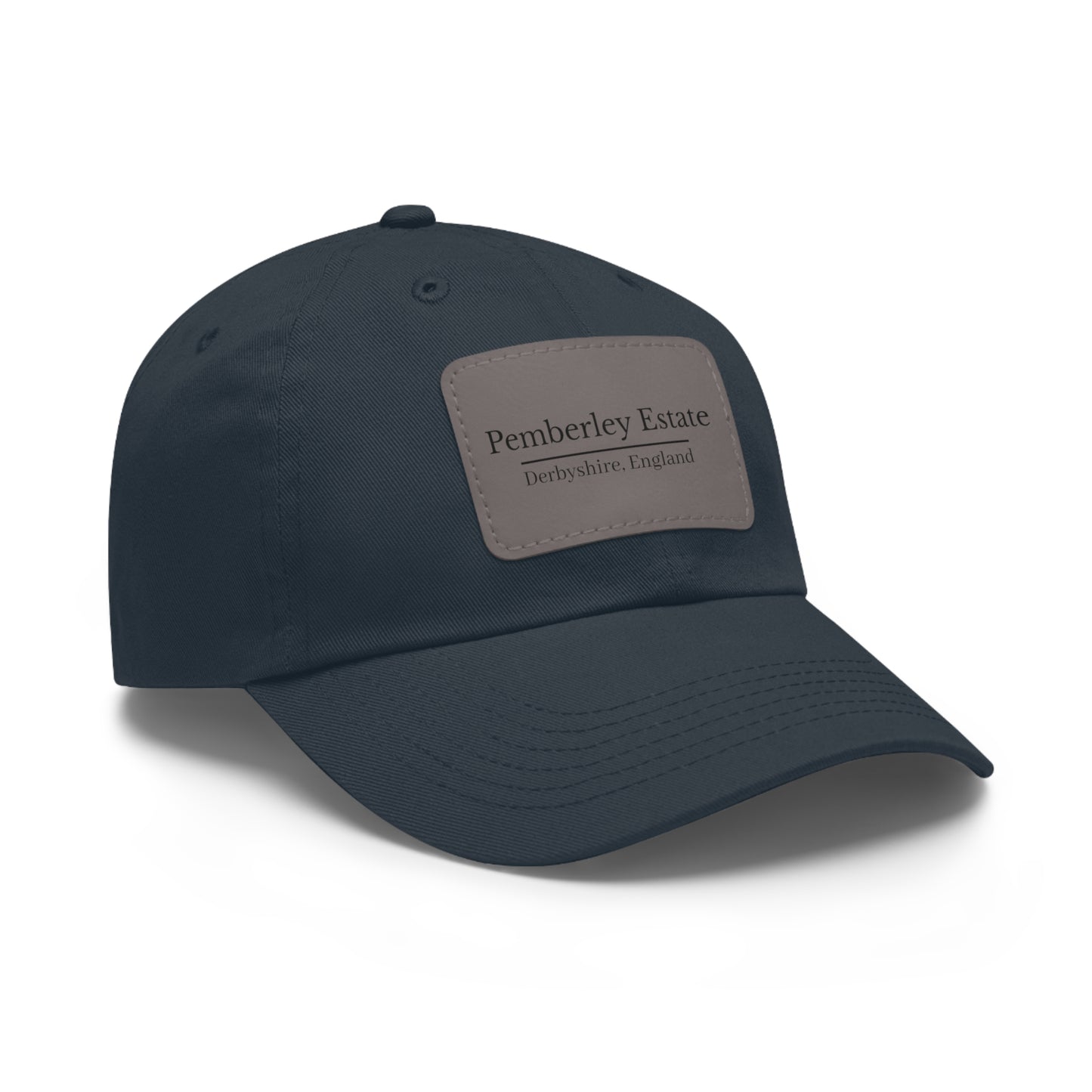 Navy blue cap with a patch featuring Pemberley Estate design on a white background