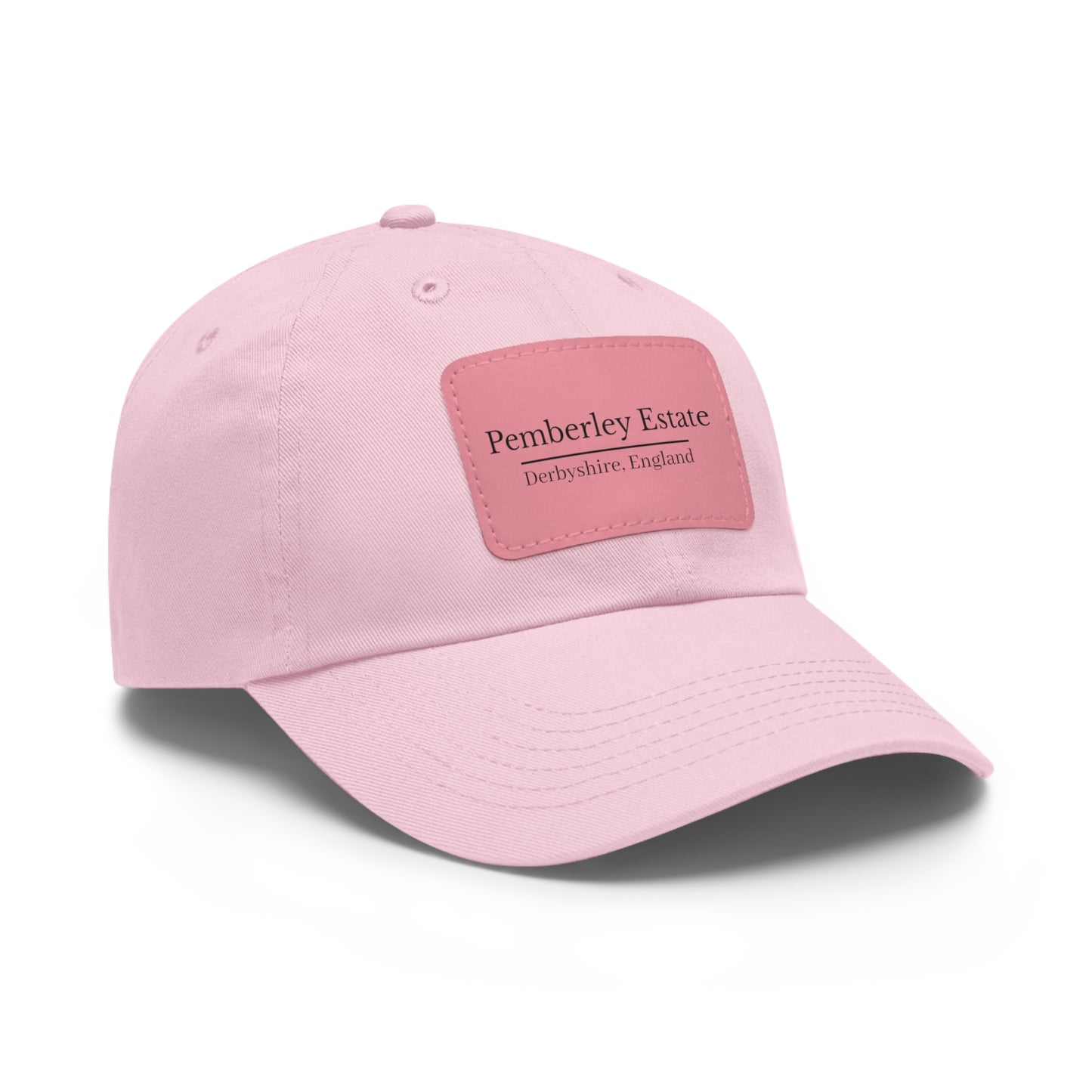 Pink baseball cap with a patch on a white background