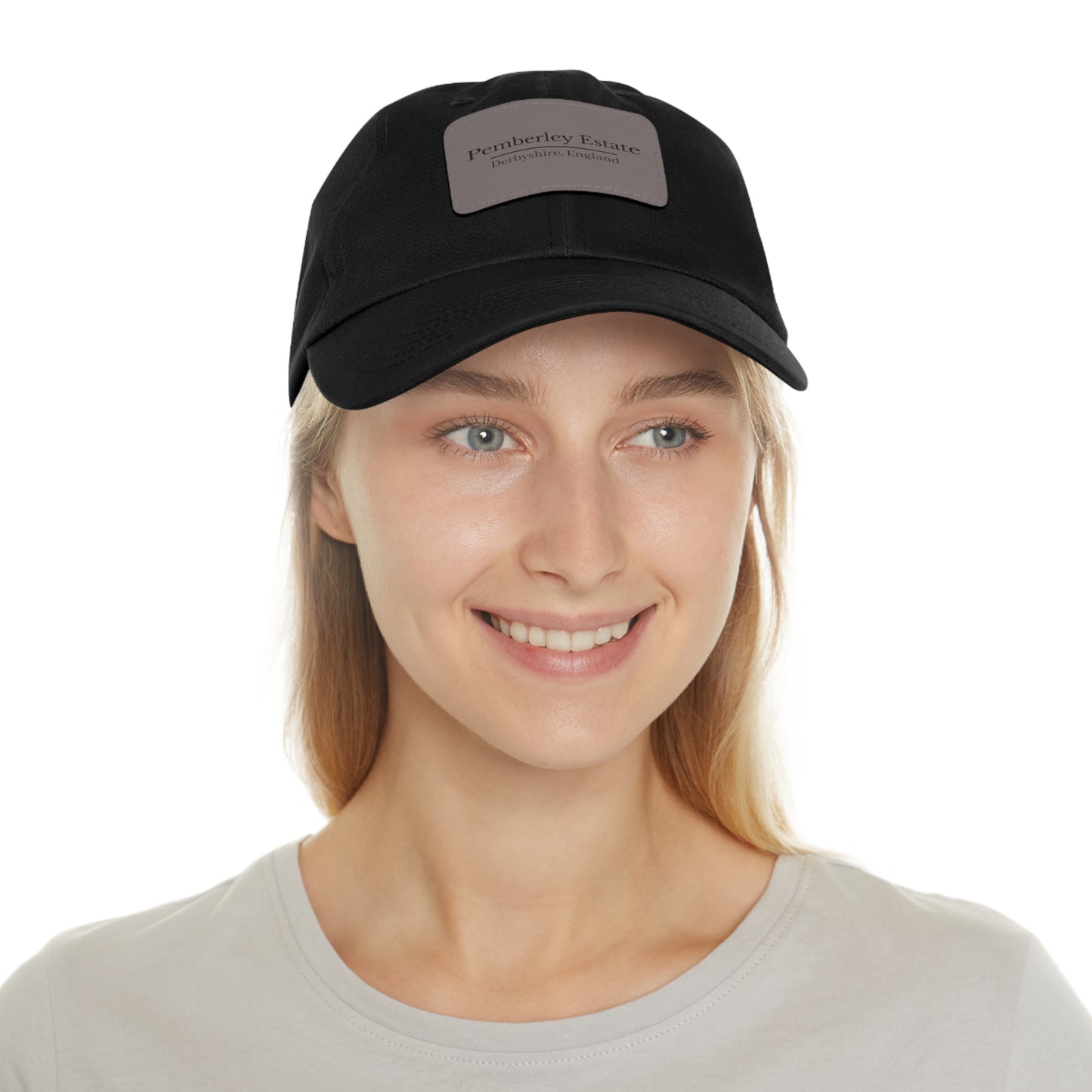 Woman wearing a black cap with a logo on a white background
