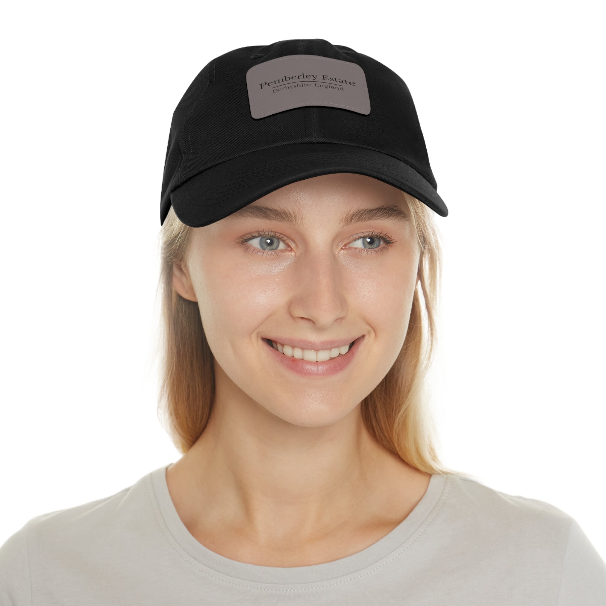 Woman wearing a black cap with a logo on a white background