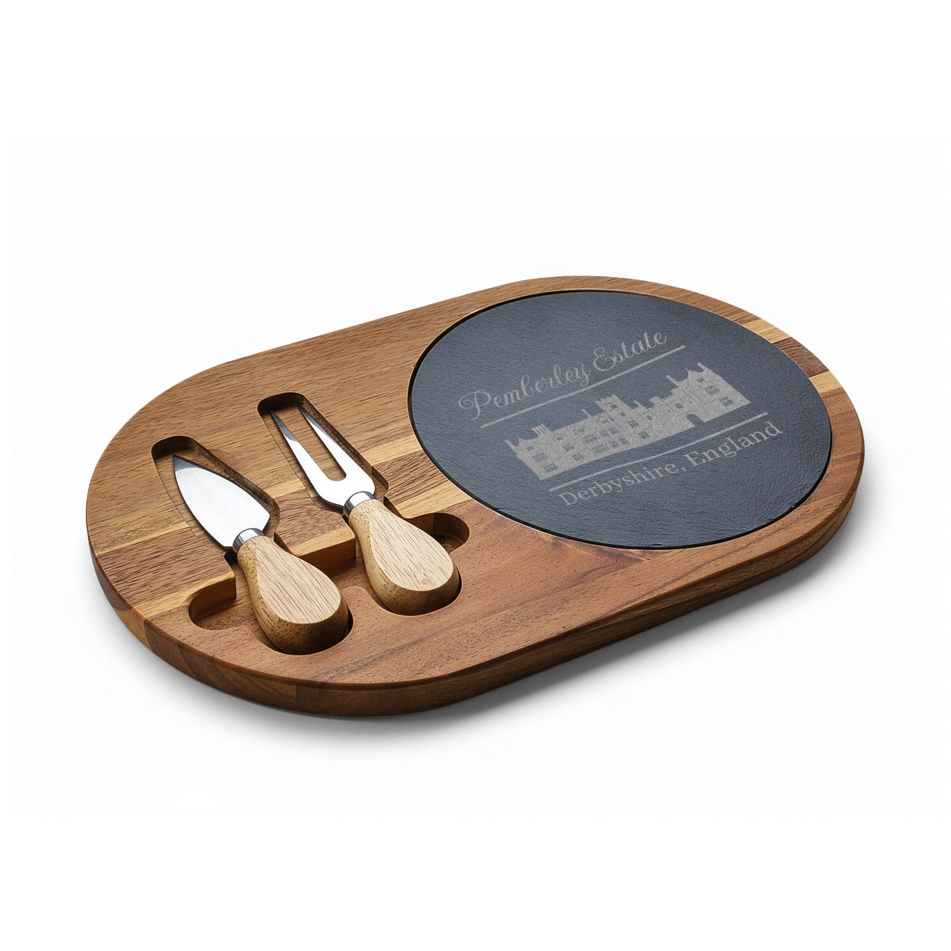 Pemberley Estate Derbyshire England with building etching on charcuterie board with utensils small angle
