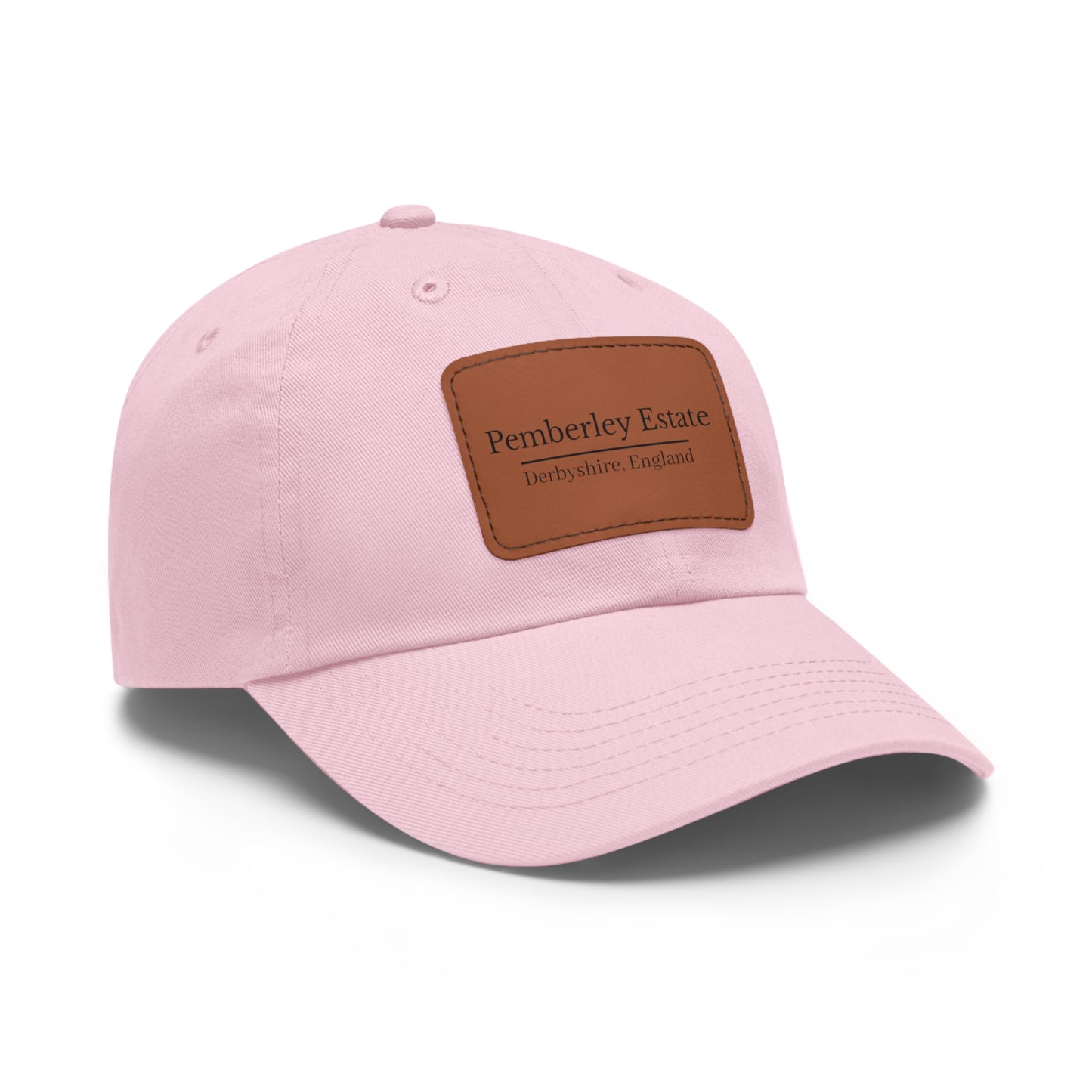Pink cap with brown leather patch on a white background