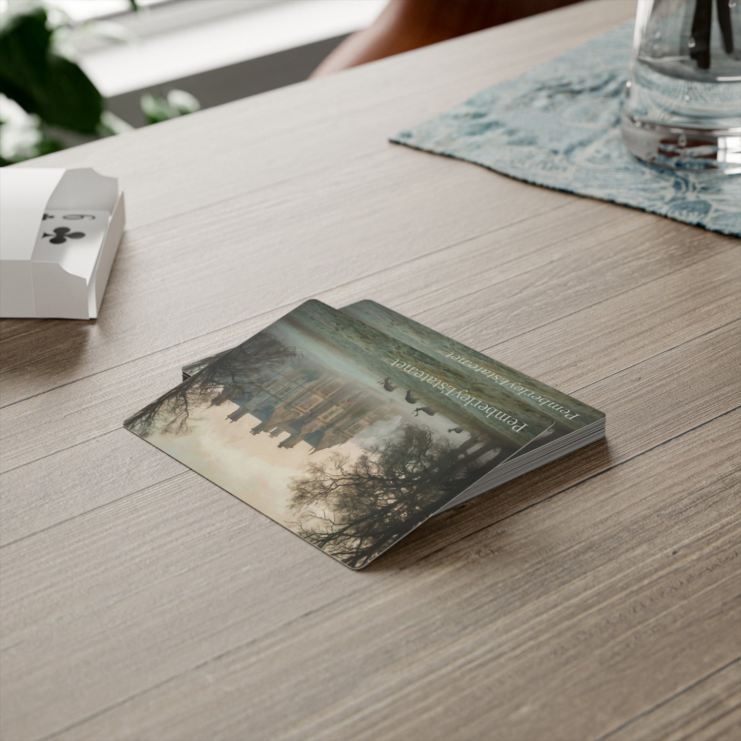 Pemberley Estate playing cards on a wooden table